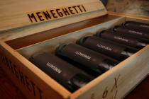 Meneghetti, bottles of wine in a wooden box
